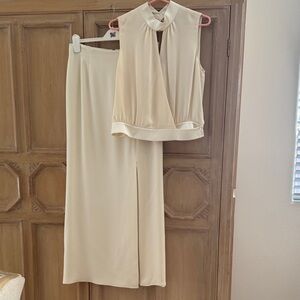 100% Silk. Top has white satin at neck and waist, skirt 41 inches long. Used